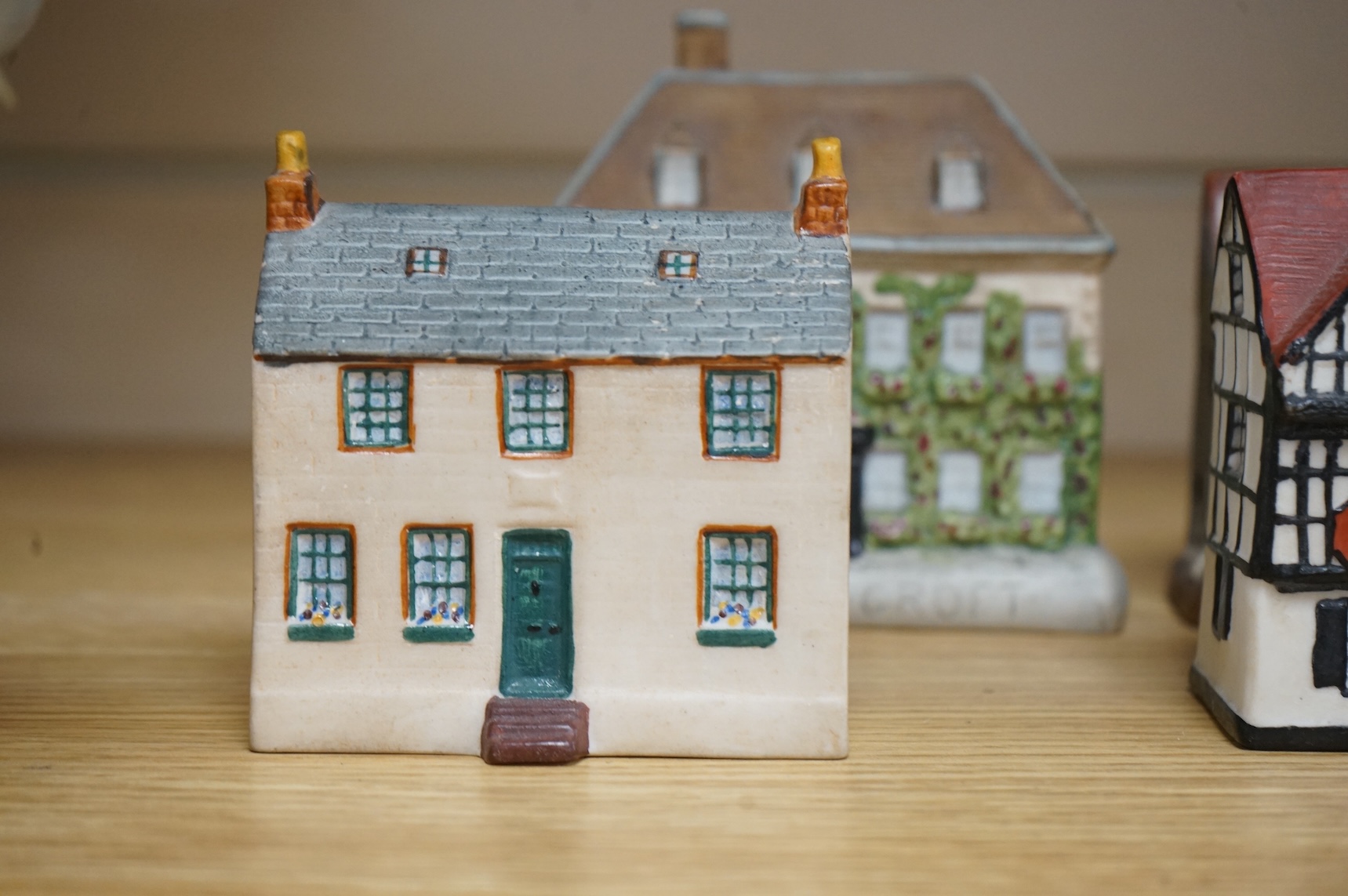 Five W.H Goss and Willow art pottery buildings, widest 14.5cm.